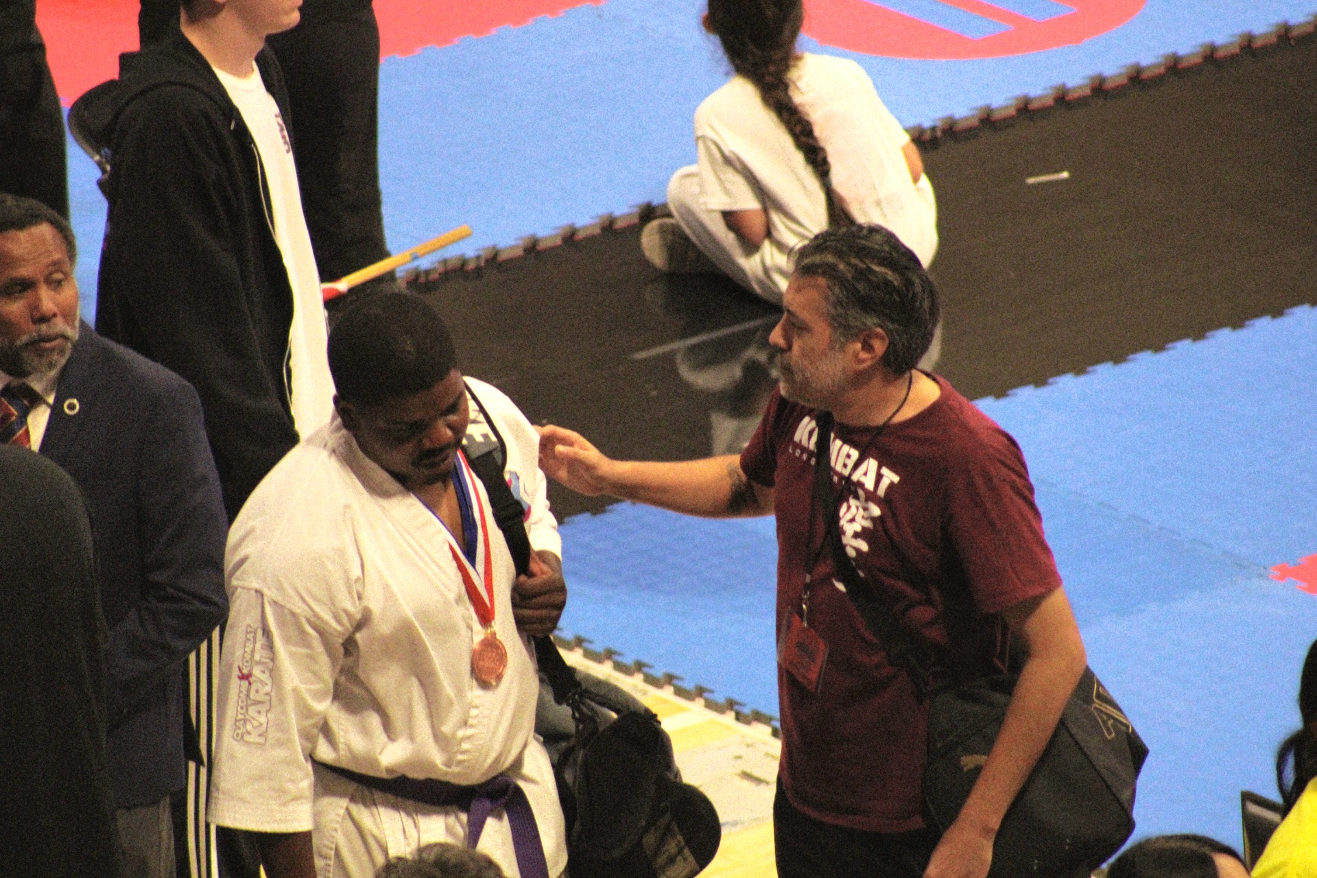 Sensei Ryan coaching a Kombat Karate competitor at a karate tournament