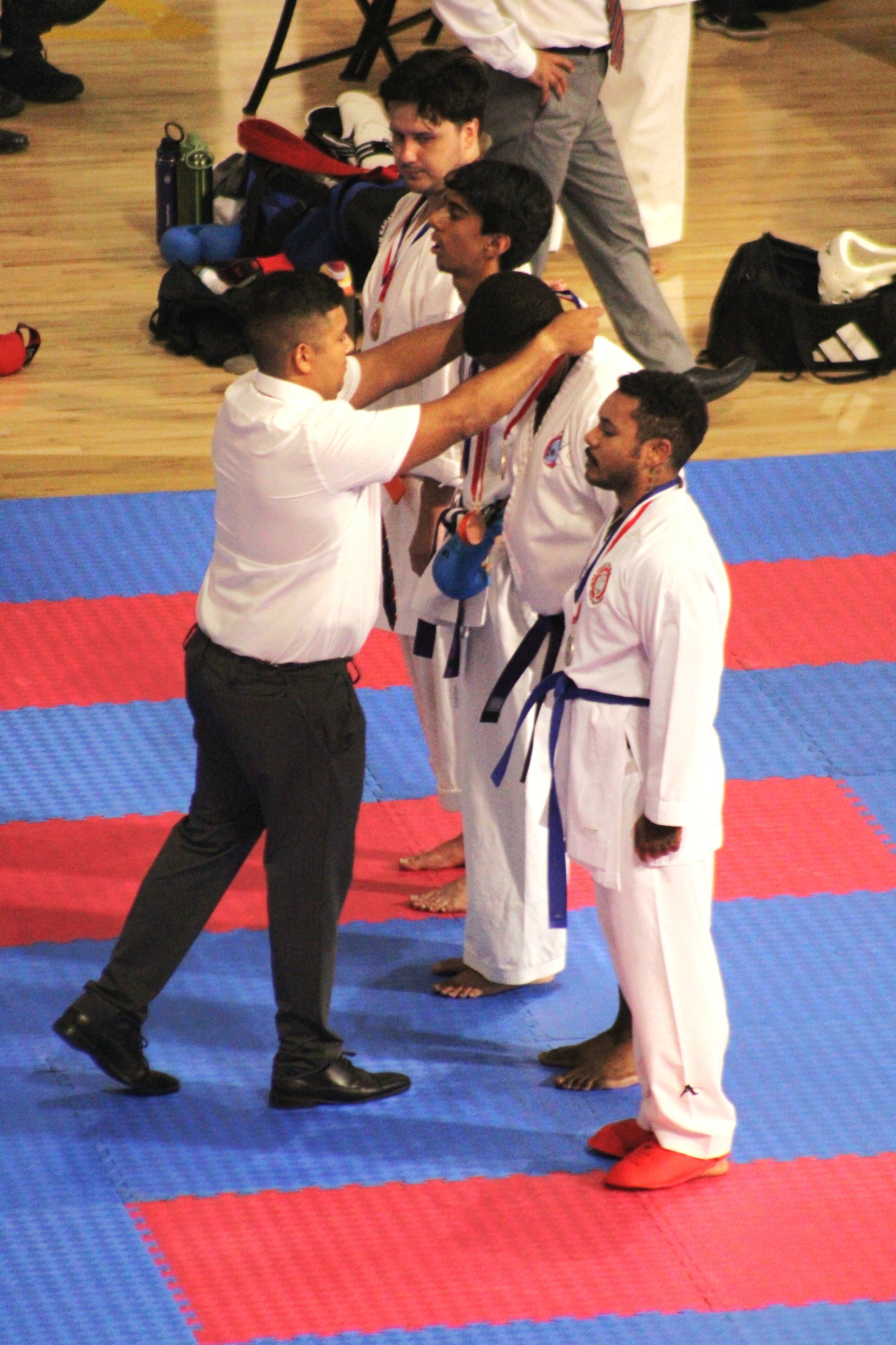 Karate tournament medal ceremony for adult sparring competitors